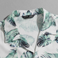 Camisa con estampado tropical con botón delantero